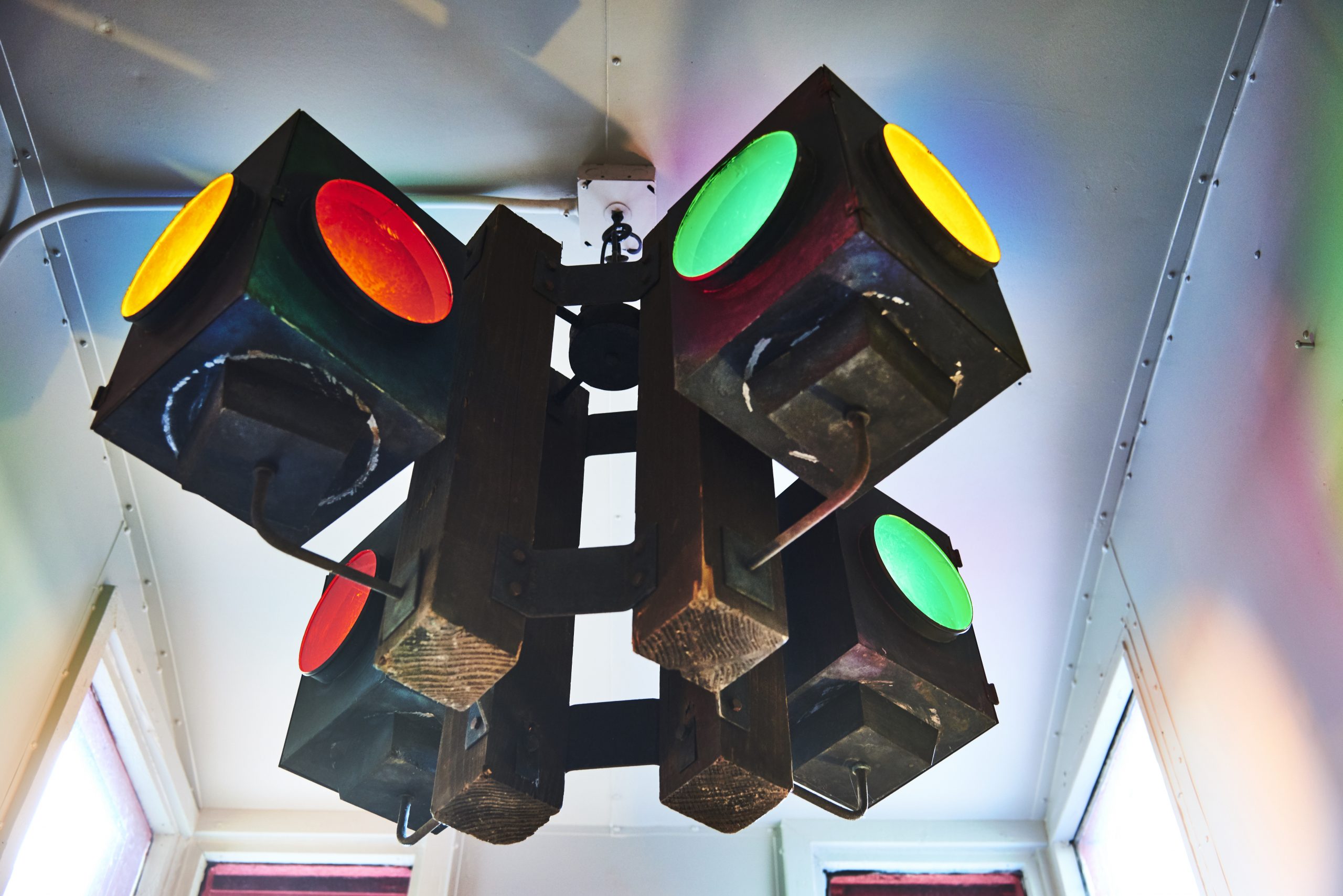 Photo of multi-colored lights hanging in the caboose.