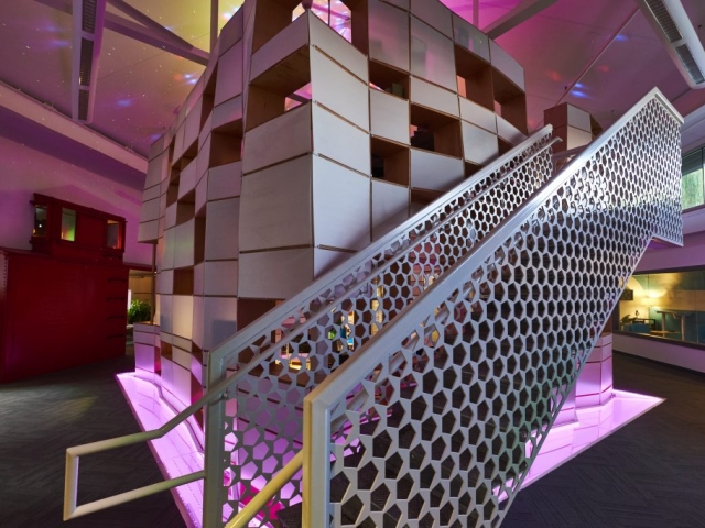Photo of Kinetic's cube work area and stairs to the second floor.