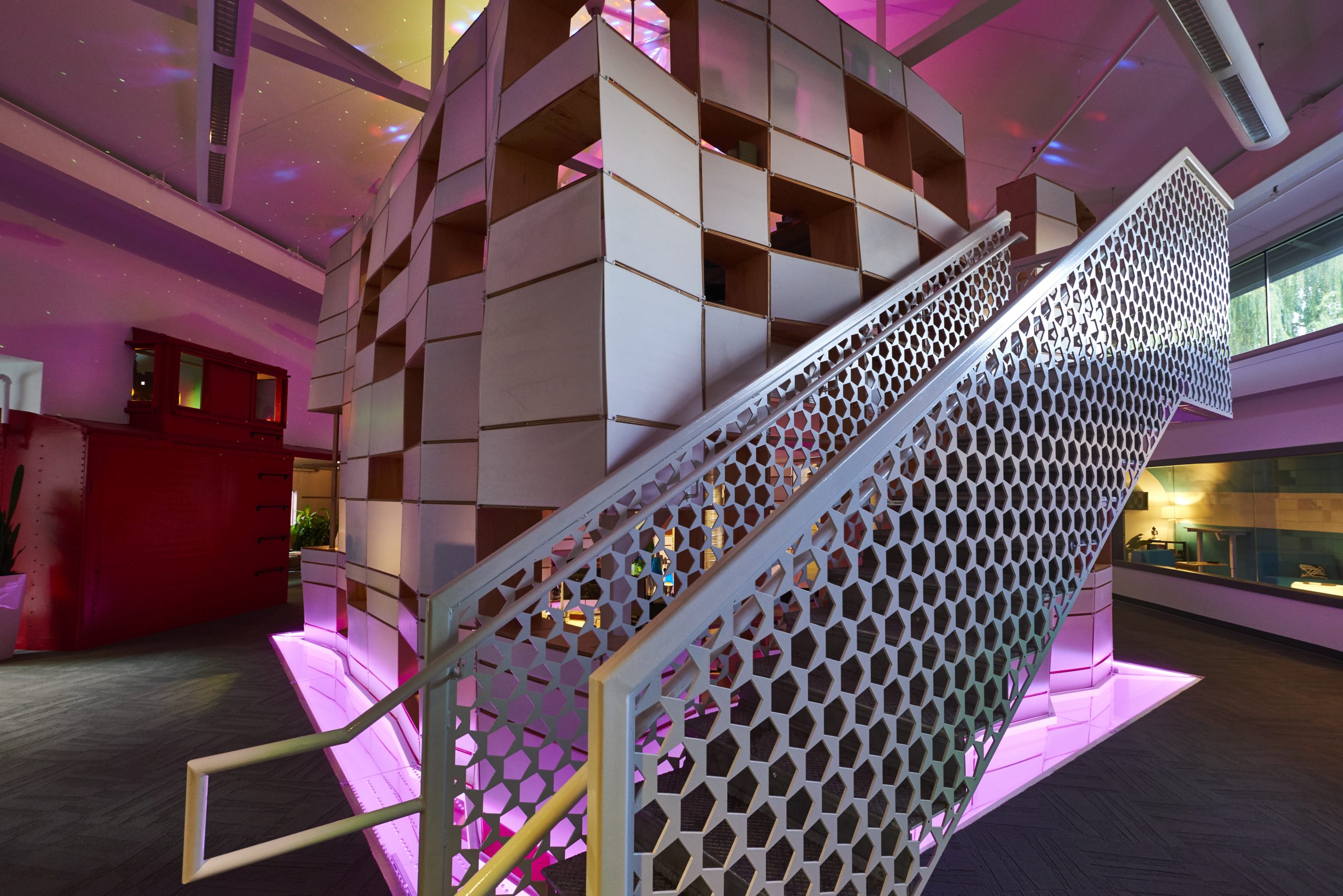 Photo of Kinetic's cube work area and stairs to the second floor.